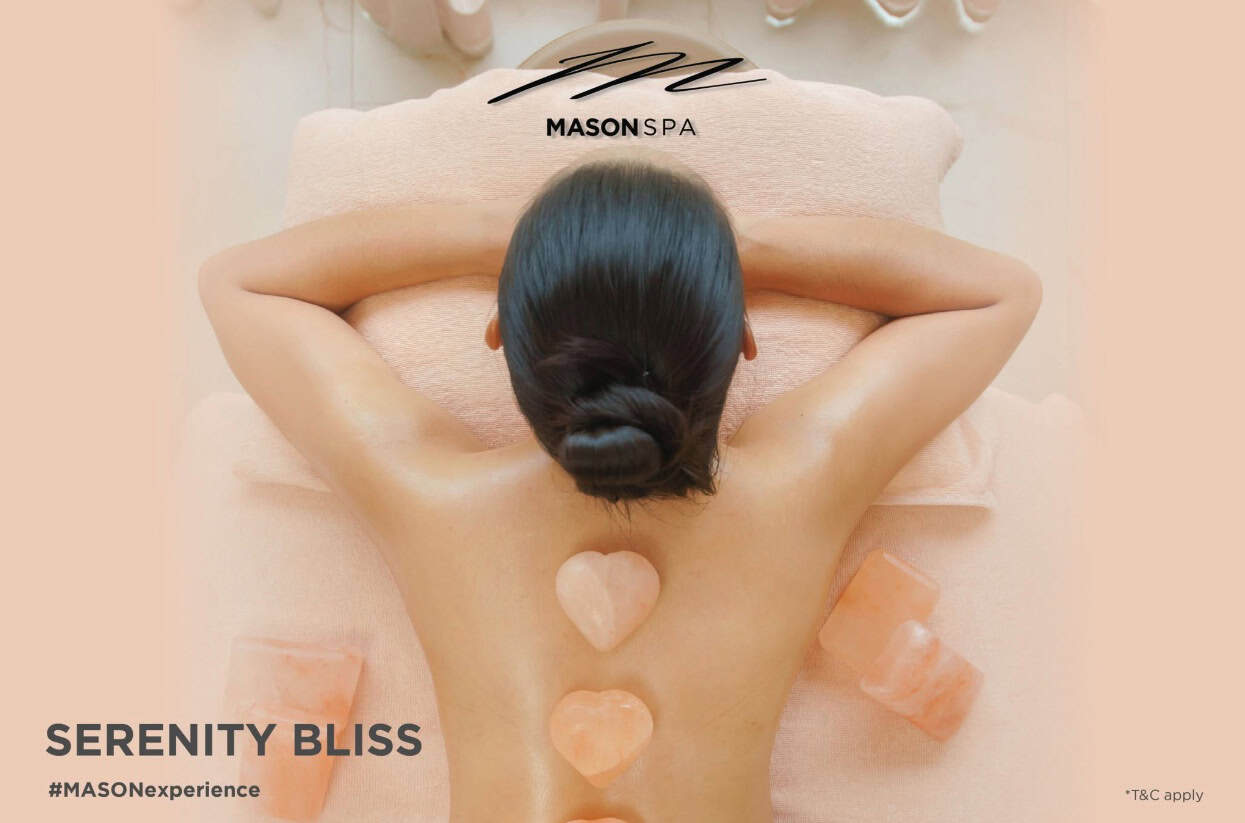 Hot stone massage for muscle knots, focusing on the back and shoulder area