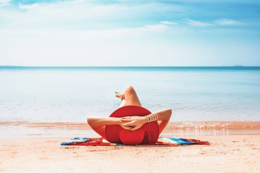 A woman relaxing on the beach in Pattaya