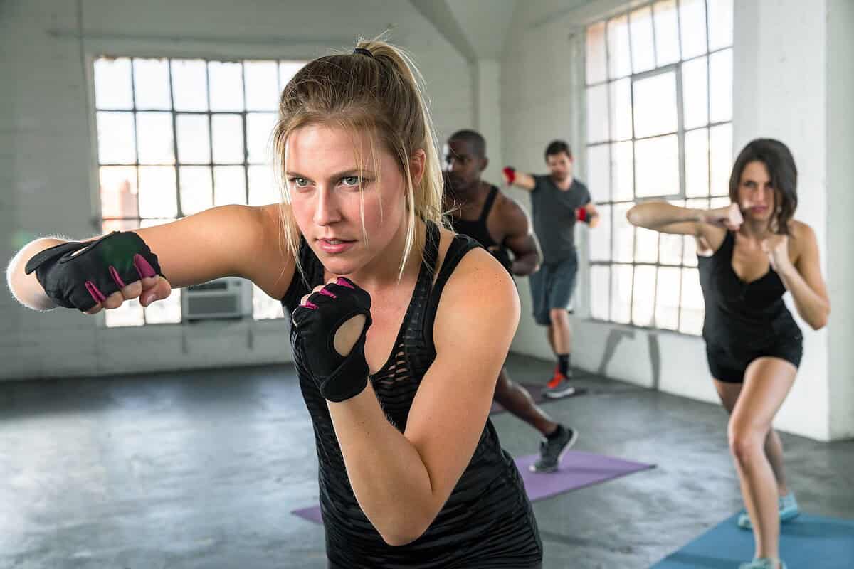 a group of men and women during a boxing class